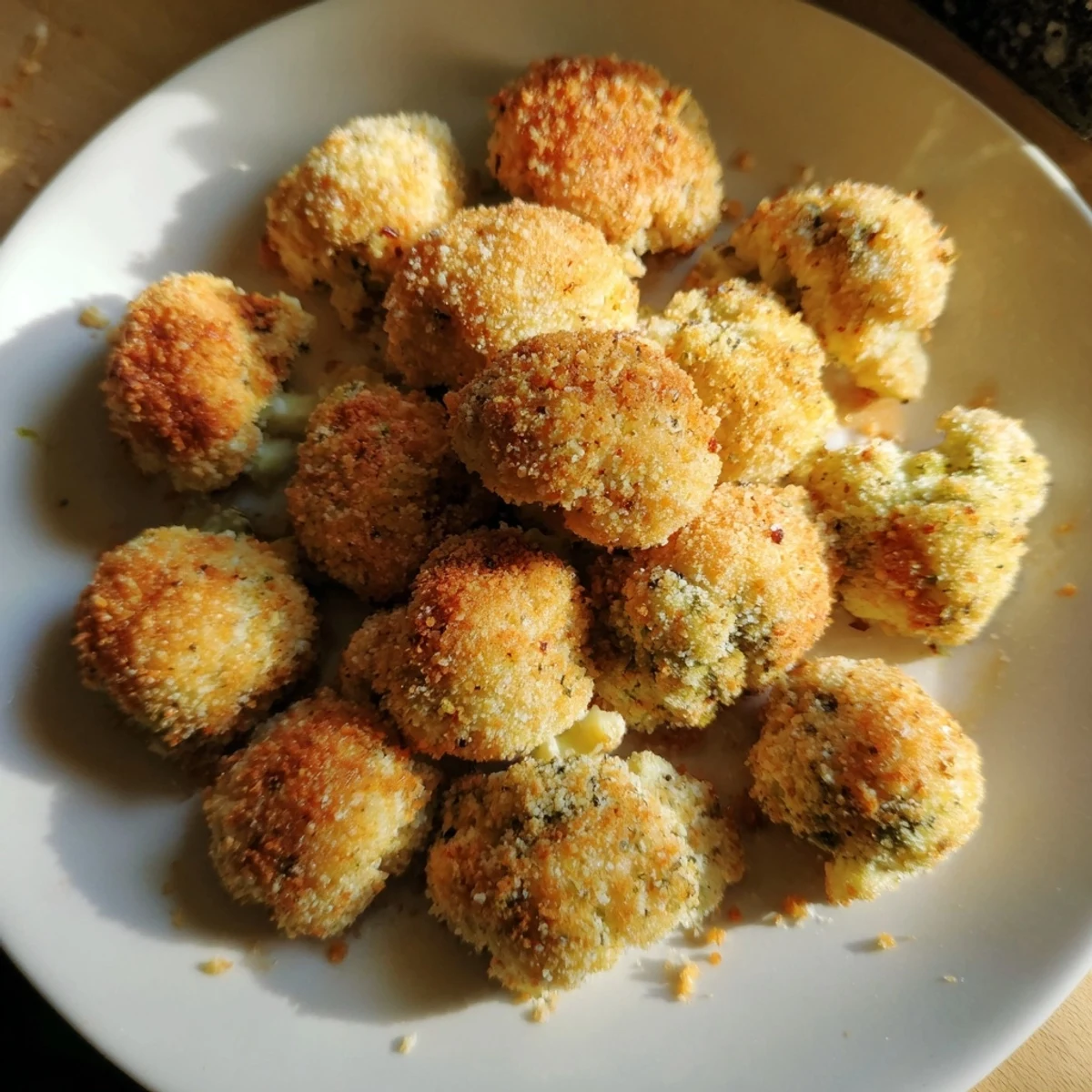 Tangy, saucy Air-Fryer Buffalo Cauliflower Bites, a vegetarian appetizer served with dipping sauces.
