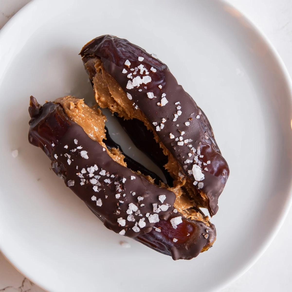 Sweet Chocolate Peanut Butter Dates, drizzled and ready to be enjoyed as a delectable, no-bake treat.
