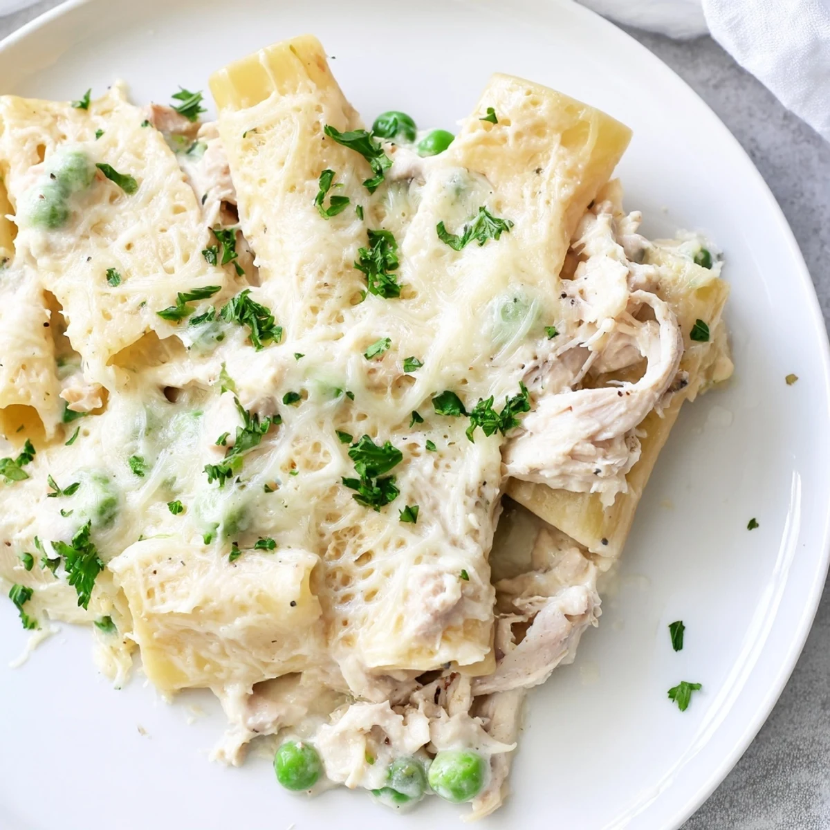 Slow Cooker Chicken Alfredo Pasta Bake: a creamy and comforting pasta dish, bubbling hot from the slow cooker.