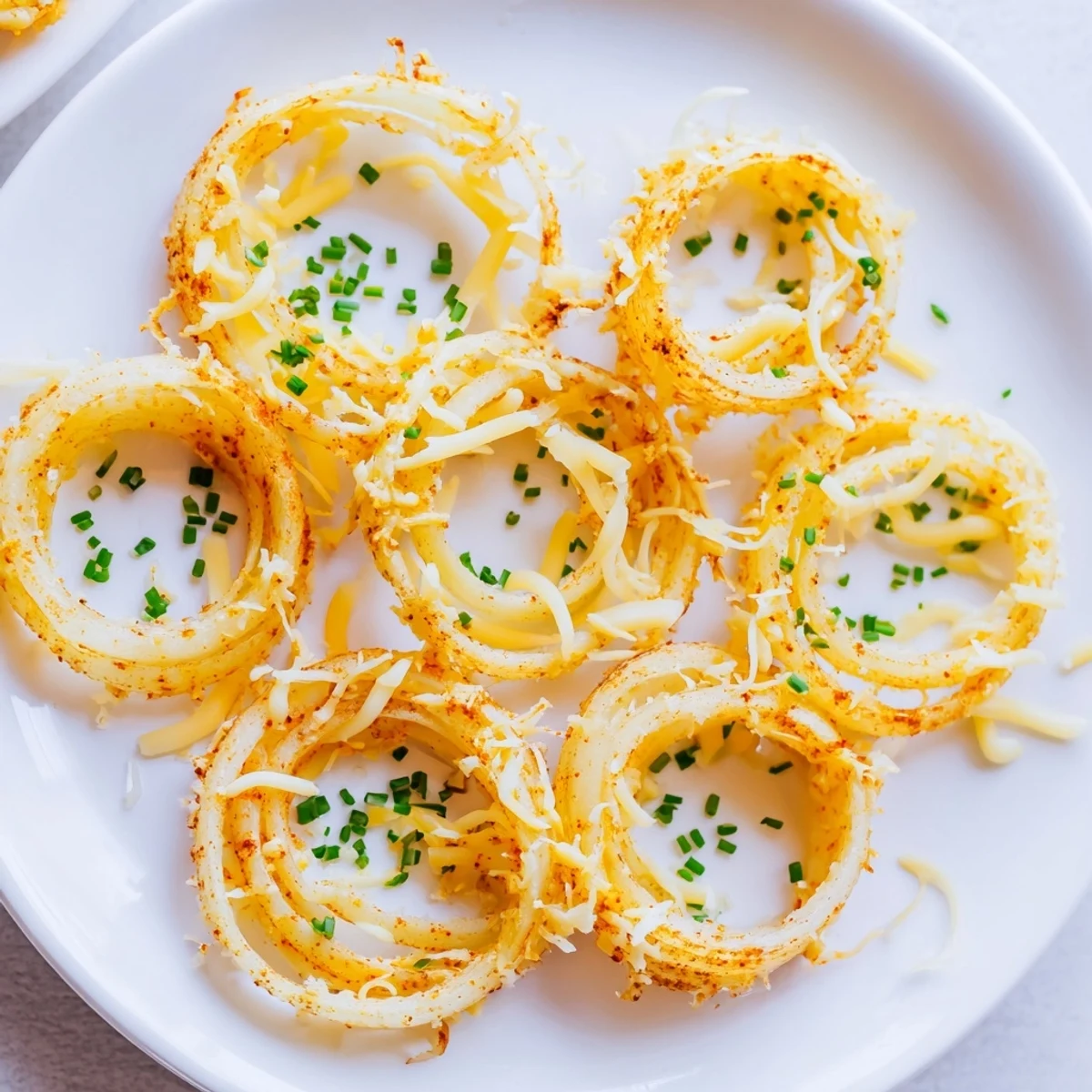 Golden, bubbly Crispy Onion Cheese Chips, a savory low-carb snack with melted cheddar and mozzarella.