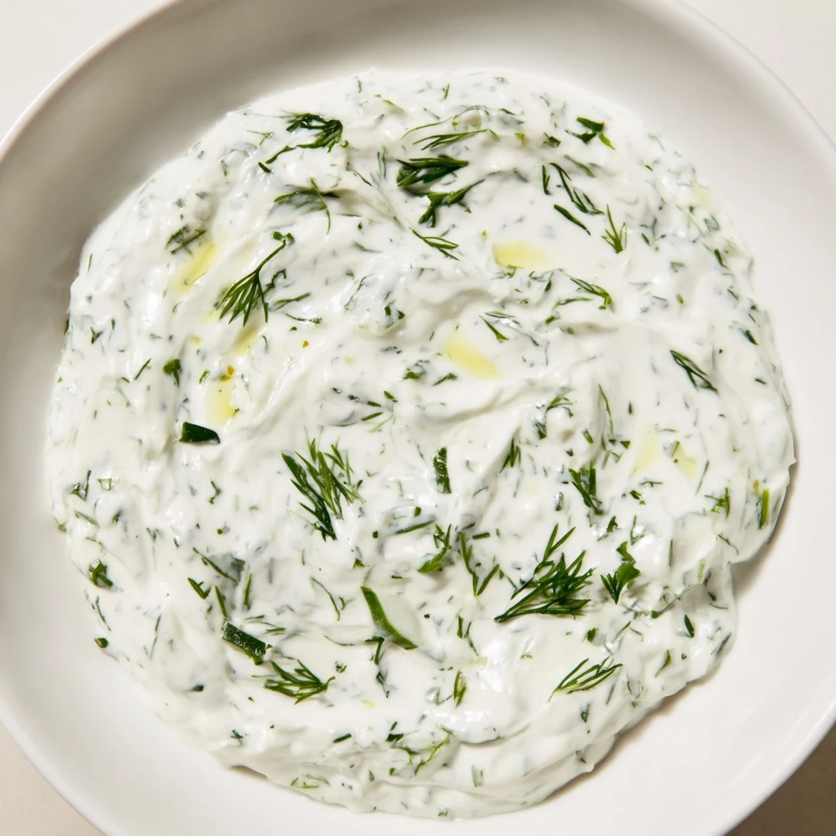 Cool and refreshing, this Greek Yogurt Herb Dip is served with colorful vegetable crudités for a delicious snack.