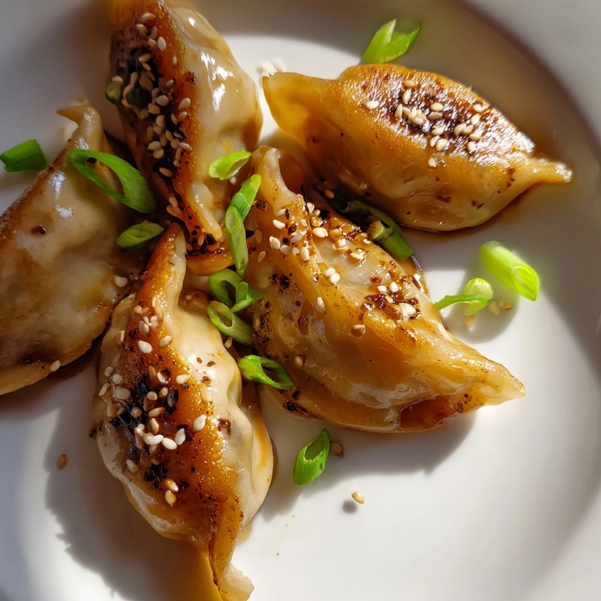 Imagine the perfectly cooked Air Fryer Frozen Dumplings with a sprinkle of sesame seeds, serving suggestion for an irresistible snack.