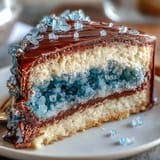 Stunning teal and gold geode graduation cake with shimmering rock candy interior, crafted to impress at any graduation party.