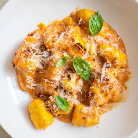Golden, cheesy Creamy Tomato Gnocchi, a one-pan meal with a creamy sauce.