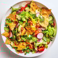 A colorful Fattoush Crunch Salad with bright vegetables and crunchy pita, ready to serve.